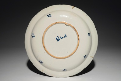A Dutch Delft cashmire palette dish with a bird and insects among flowers, 1st half 18th C.